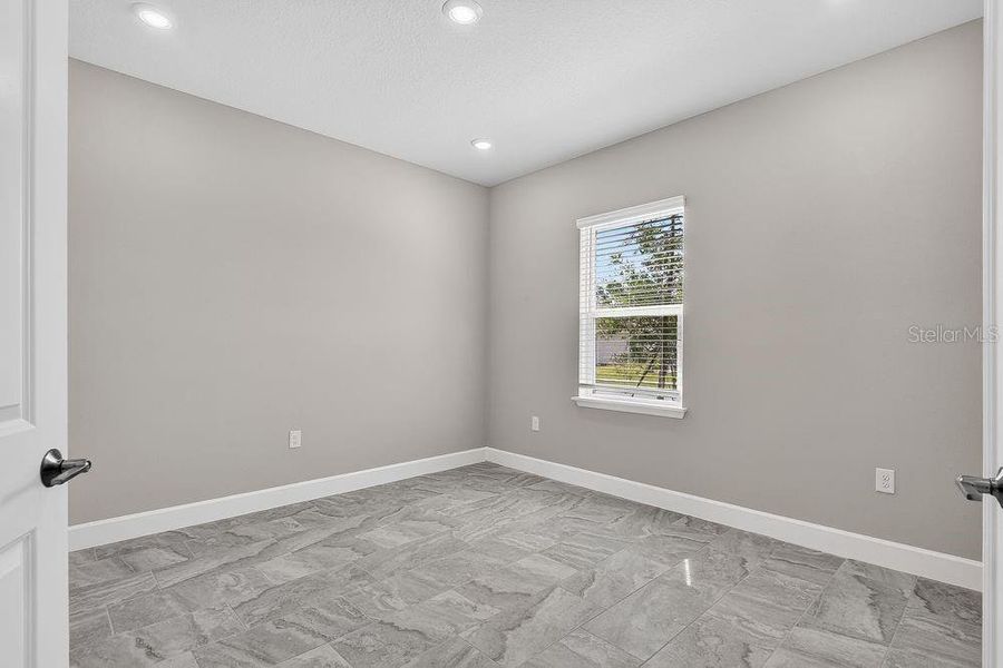 Spacious, unfurnished interior of a new home in Colbert Landings, Palm Coast (Image 29).