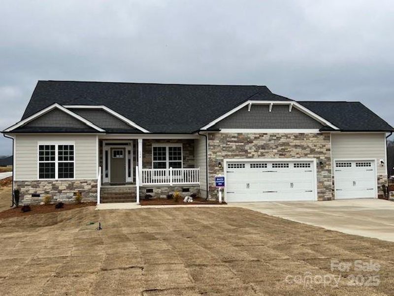 Front exterior of a new home in Swann Hills, Statesville, NC, highlighting curb appeal (Image 1). Front exterior of a new home in Swann Hills, Statesville, NC, highlighting curb appeal (Image 1).