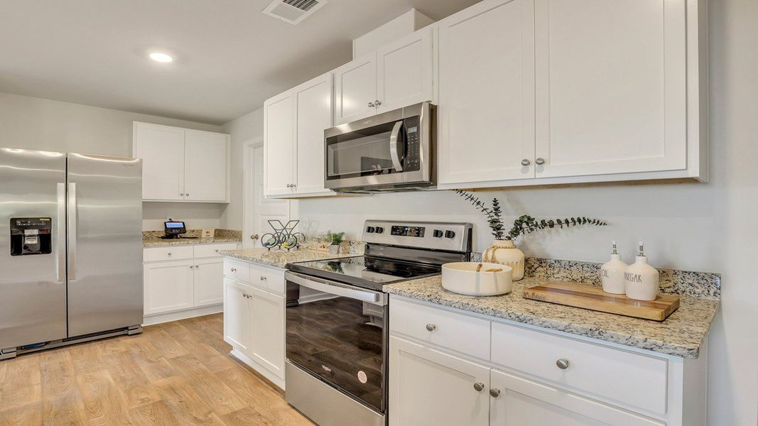 Representative furnished interior of a home built from the ROBIE by D.R. Horton in Longleaf Village, Rincon (Image 12).