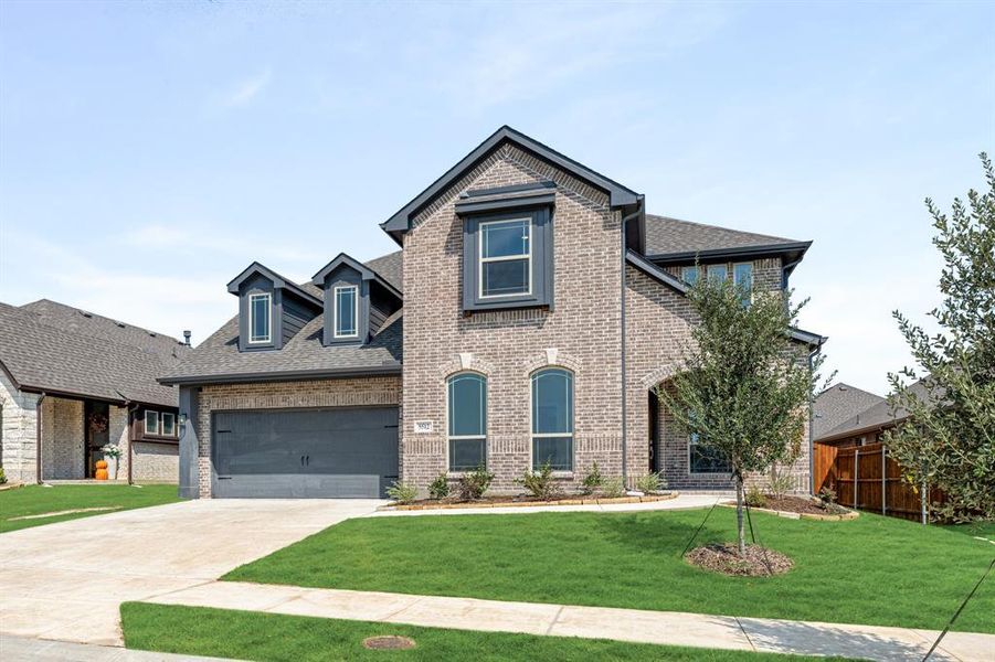 Front exterior of a new home in Country Lakes Classic 60, Argyle, TX, highlighting curb appeal (Image 2).