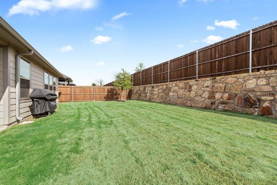 Exterior details and patio area of a home in Tesoro at Chisholm Trail Ranch, Crowley (Image 28).