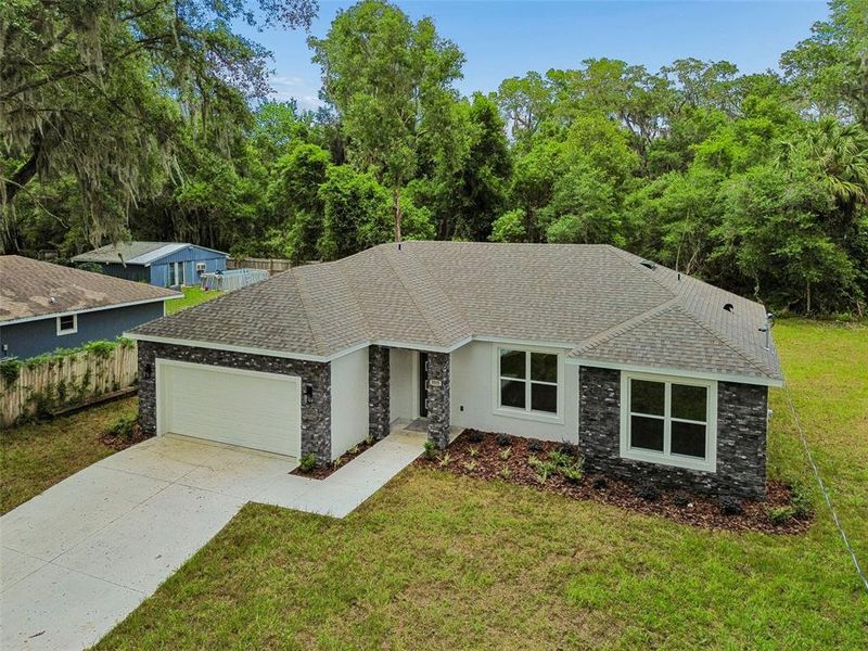 Front exterior of a new home in , Deland, FL, highlighting curb appeal (Image 27).