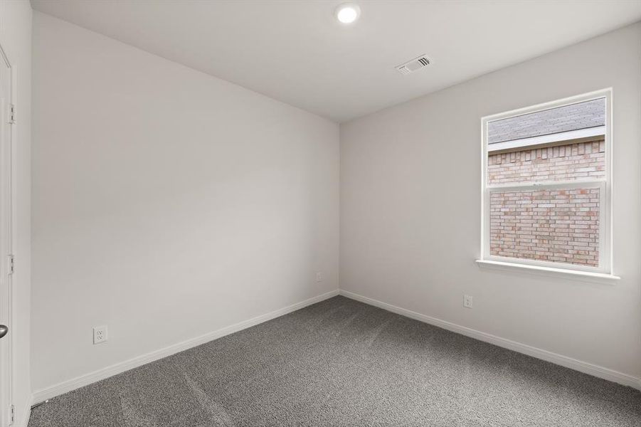 Carpeted spare room with baseboards and recessed lighting Carpeted spare room with baseboards and recessed lighting