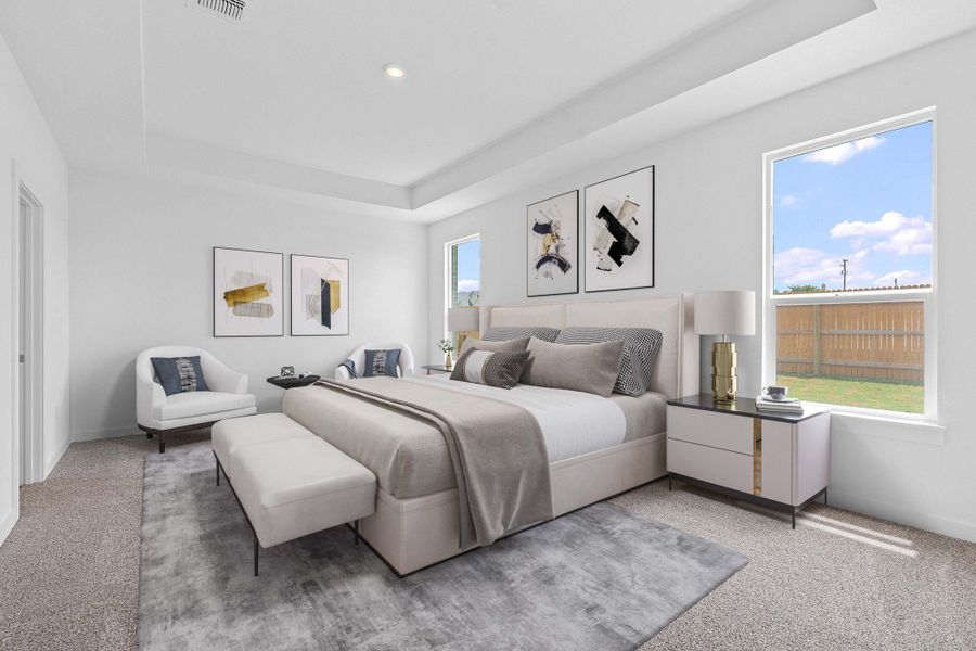 Carpeted bedroom featuring a raised ceiling Carpeted bedroom featuring a raised ceiling