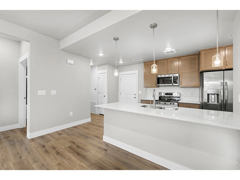 Furnished interior view inside a new home in Highlands at Fox Hill - The Flats, Longmont (Image 9).