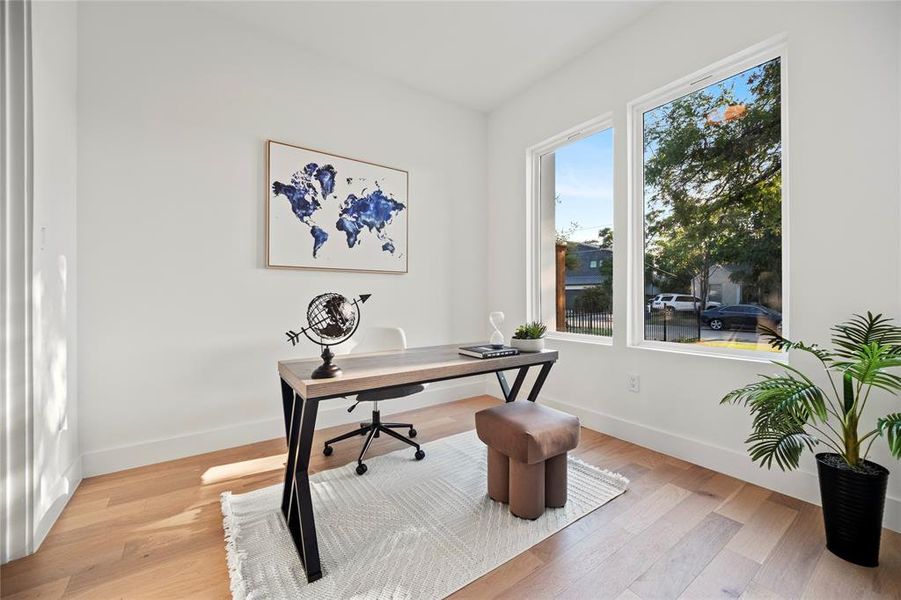 Home office featuring light hardwood / wood-style floors