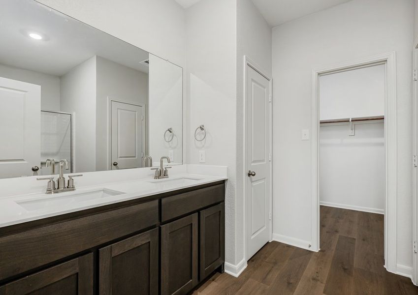 The master bathroom has a sprawling dual-sink vanity.