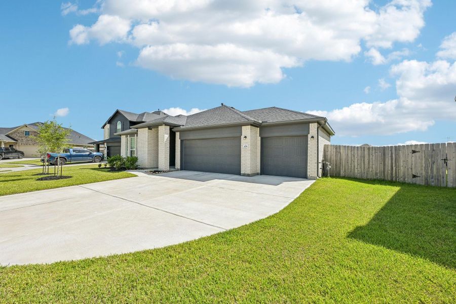 Front exterior of a new home in , Alvin, TX, highlighting curb appeal (Image 1). Front exterior of a new home in , Alvin, TX, highlighting curb appeal (Image 1).