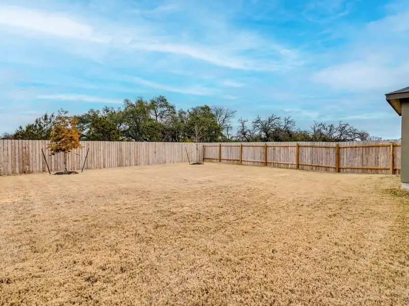 Full Sprinkler System Tucked away on an oversized lot, this home offers ultimate privacy with a greenbelt backdrop and no neighbors on the right or behind