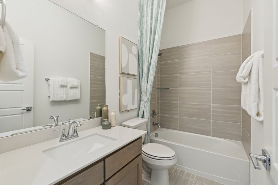 Bathroom in the Gilmour home plan by Trophy Signature Homes – REPRESENTATIVE PHOTO Bathroom in the Gilmour home plan by Trophy Signature Homes – REPRESENTATIVE PHOTO