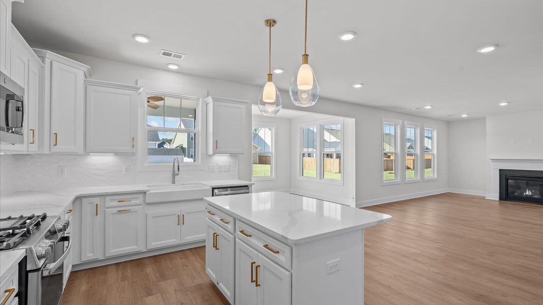 Accomplished design in a kitchen that blends function and form with a right-sized island Accomplished design in a kitchen that blends function and form with a right-sized island