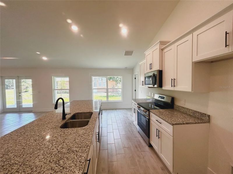 Furnished interior view inside a new home in Deep Creek, Punta Gorda (Image 5).