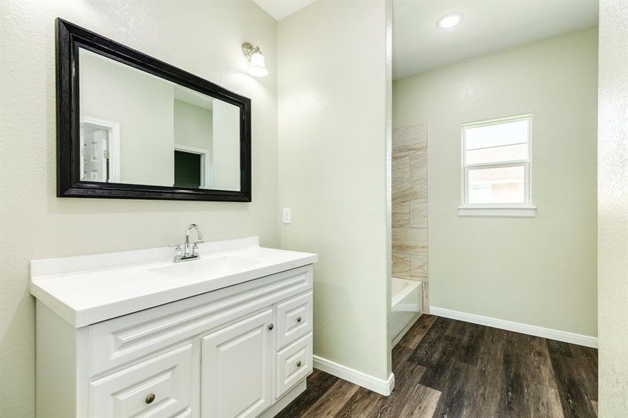 Primary Bath with Vanity and Mirror.