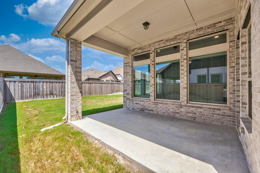 Exterior details and patio area of a home in Dunham Pointe - Enclave Collection, Cypress (Image 4).
