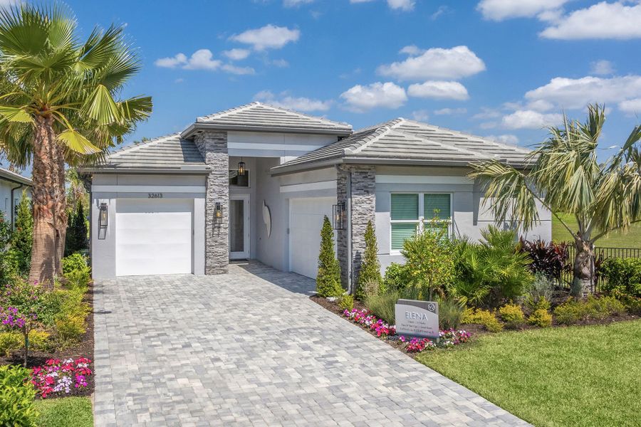 Representative exterior photo of a completed home built from the Elena by GL Homes in Valencia Ridge, Wesley Chapel, FL (Image 24). Representative exterior photo of a completed home built from the Elena by GL Homes in Valencia Ridge, Wesley Chapel, FL (Image 24).