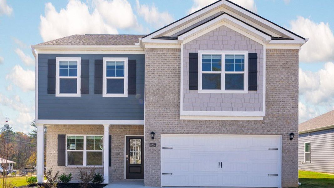 Front exterior of a new home in Hillcrest Landing, McDonald, TN, highlighting curb appeal (Image 1).