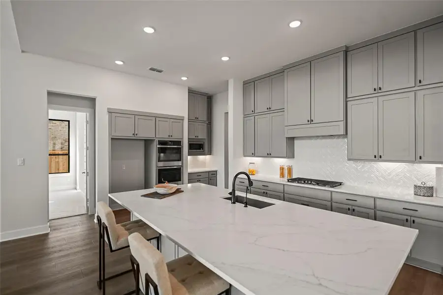 Furnished interior view inside a new home in Bridgeland 70′, Cypress (Image 10).