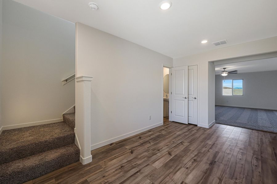 The entryway opens up to the living room.