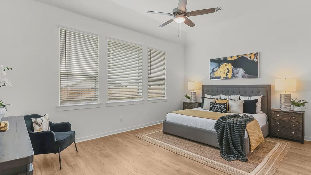 Representative furnished interior of a home built from the Lauren by Chesmar Homes in University Heights, Round Rock (Image 12).