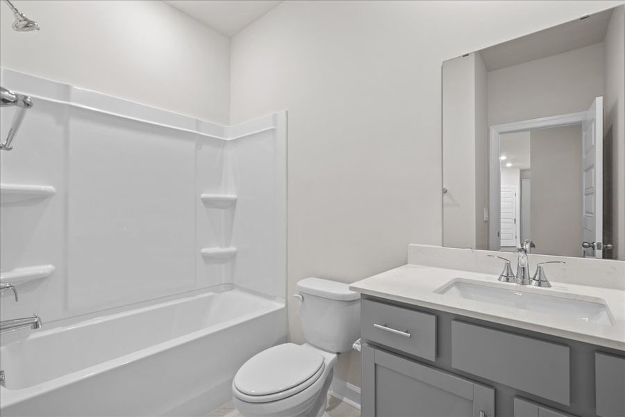 Furnished interior view inside a new home in The Farm at Wells Creek - Signature Collection, Gray Court (Image 8). Furnished interior view inside a new home in The Farm at Wells Creek - Signature Collection, Gray Court (Image 8).