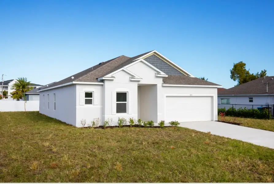 Front exterior of a new home in Cape Coral, Cape Coral, FL, highlighting curb appeal (Image 2). Front exterior of a new home in Cape Coral, Cape Coral, FL, highlighting curb appeal (Image 2).