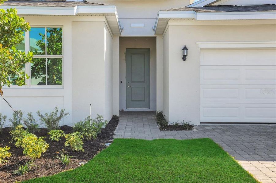 Exterior details and patio area of a home in Brystol North at Wylder, Port St. Lucie (Image 17).