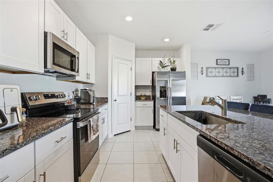 Furnished interior view inside a new home in The Isle of Avalon, Spring Hill (Image 11).