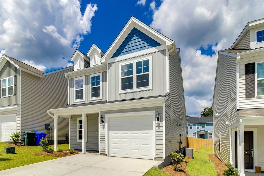 Front exterior of a new home in Ellington, Elgin, SC, highlighting curb appeal (Image 2). Front exterior of a new home in Ellington, Elgin, SC, highlighting curb appeal (Image 2).