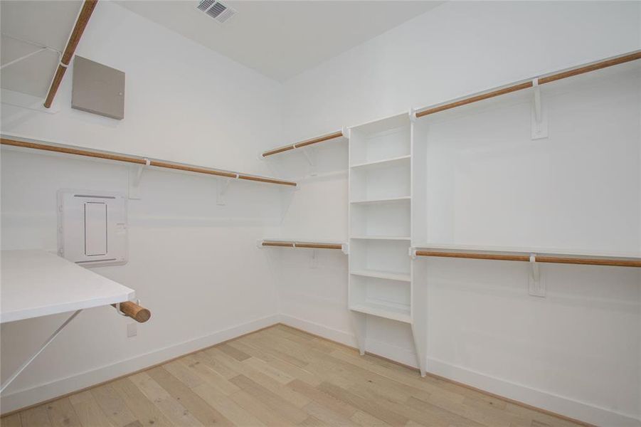 Primary closet #1. Photos of similar completed home by same builder. Selections may differ.