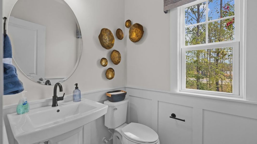 Convenient powder room with window in the Jordan Design by DRB Homes in York, SC