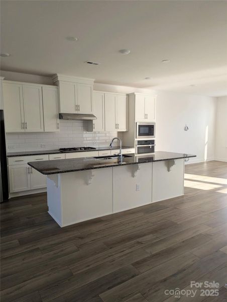 Upper level open floor plan. Gourmet kitchen