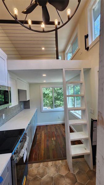 Looking from kitchen sink towards loft and living room. Looking from kitchen sink towards loft and living room.