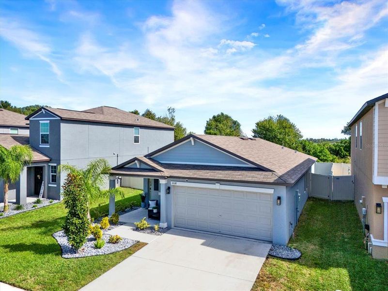 Front exterior of a new home in , Wimauma, FL, highlighting curb appeal (Image 1).
