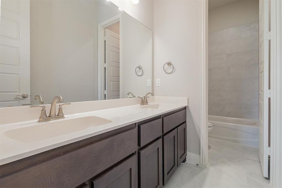 Bathroom with vanity and toilet