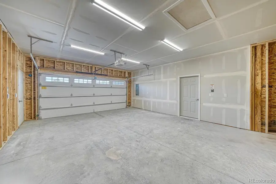 Two car garage with electric charging station: Photos not of actual home but similar model Two car garage with electric charging station: Photos not of actual home but similar model