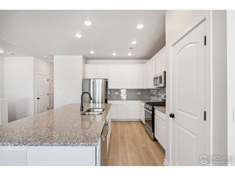 Furnished interior view inside a new home in Kinston Mainstreet Townhomes, Loveland (Image 10).