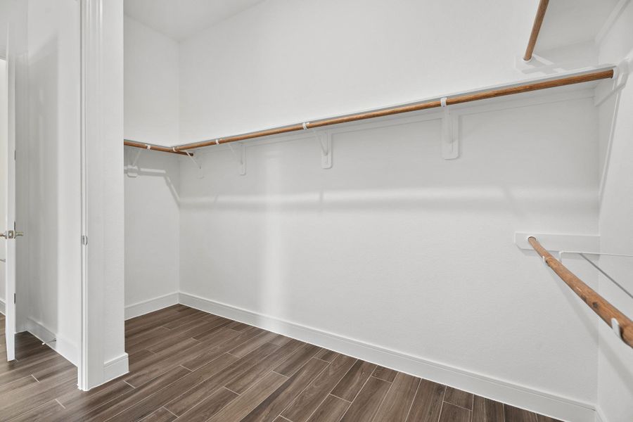 Primary walk-in closet (*Photo not of actual home and used for illustration purposes only.)