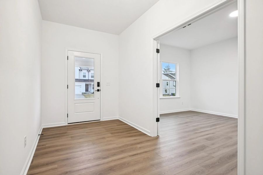 Foyer featuring the AW Collection® Foundry - A stark, stylish entry with dramatic simplicity.