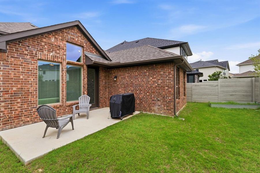 Exterior details and patio area of a home in Harvest, Argyle (Image 3).