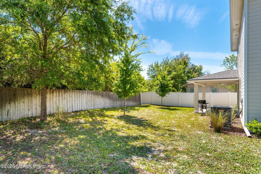 Exterior details and patio area of a home in Woodbridge, Fernandina Beach (Image 31).