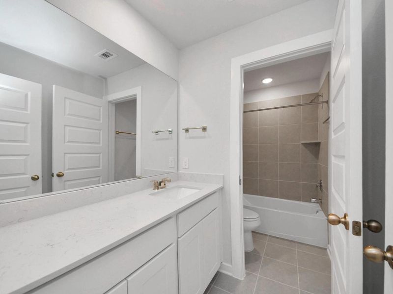 Furnished interior view inside a new home in Caney Creek Place, Conroe (Image 17).