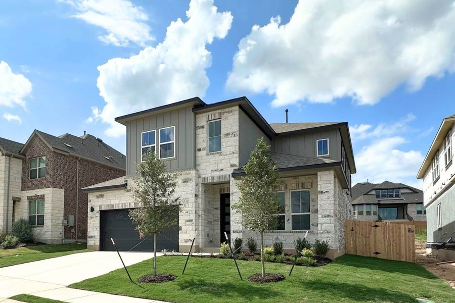 Front exterior of a new home in Bluffview Reserve, Leander, TX, highlighting curb appeal (Image 20).