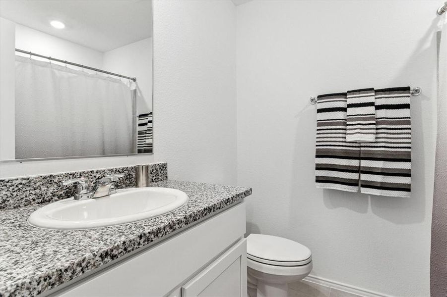 Hall Bath with Combo Tub/Shower. Granite Vanity