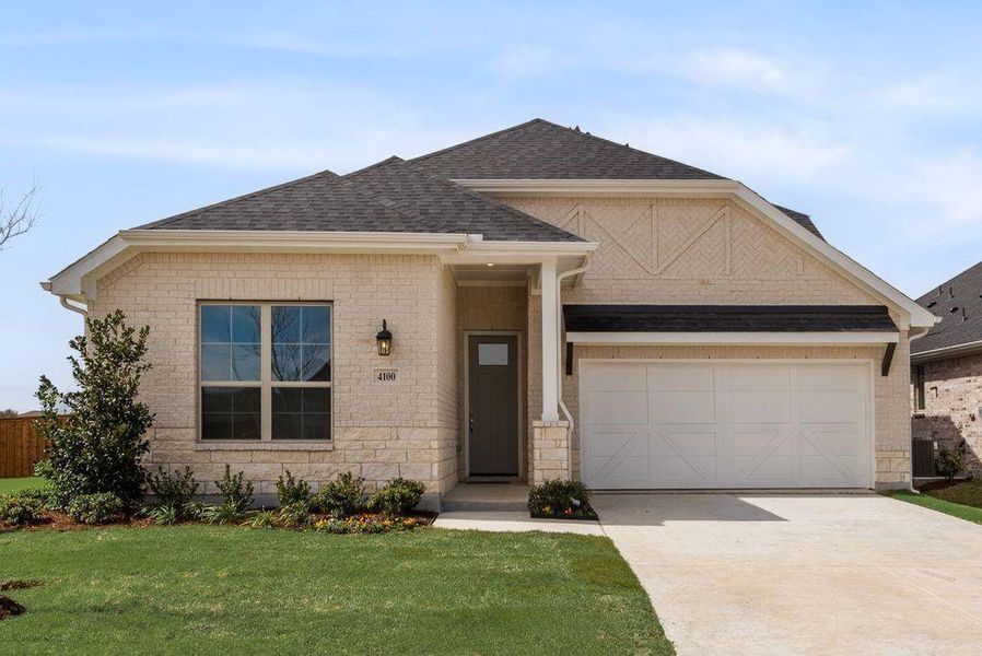 Front exterior of a new home in Spiritas Ranch, Little Elm, TX, highlighting curb appeal (Image 23).