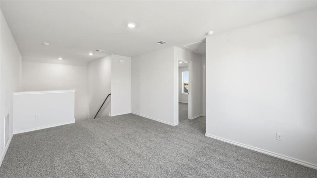 Empty room featuring carpet floors and recessed lighting