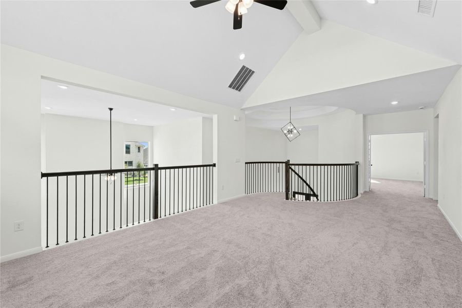 Spare room featuring high vaulted ceiling, carpet, a ceiling fan, beam ceiling, and recessed lighting Spare room featuring high vaulted ceiling, carpet, a ceiling fan, beam ceiling, and recessed lighting