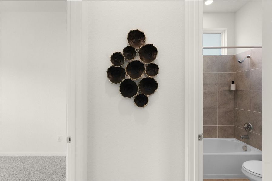 Full bathroom featuring toilet and shower / washtub combination Full bathroom featuring toilet and shower / washtub combination