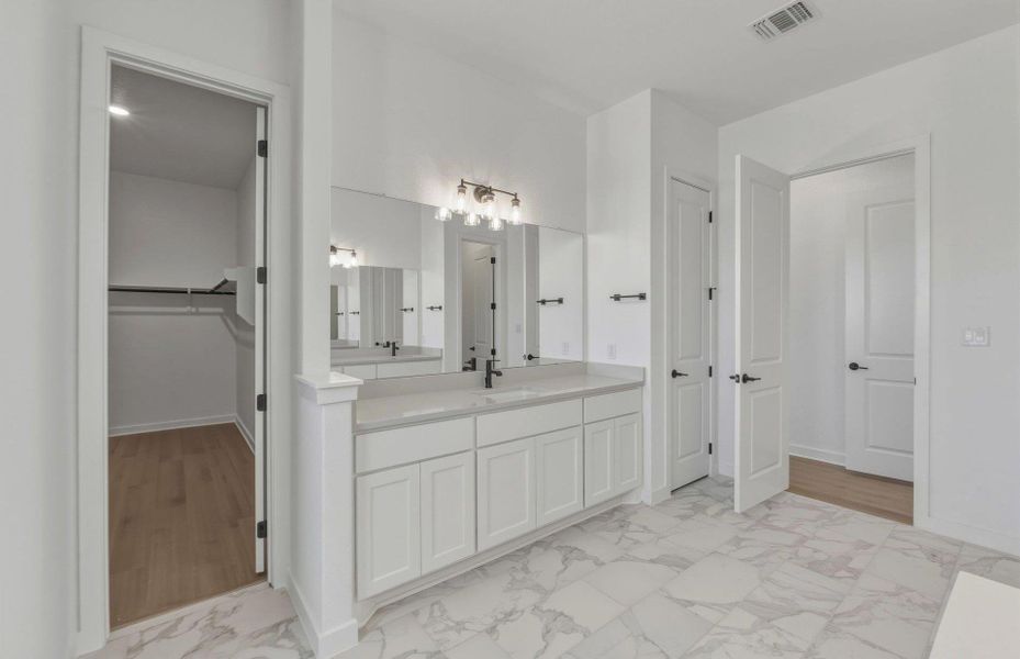 Furnished interior view inside a new home in 6 Creeks, Kyle (Image 7).