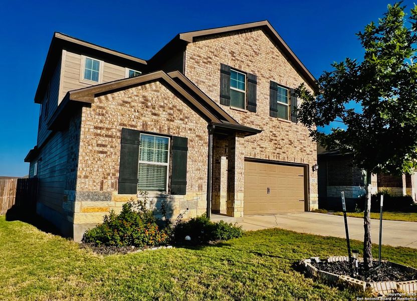 Front exterior of a new home in Legendary Trails - Premier Series, Cibolo, TX, highlighting curb appeal (Image 1). Front exterior of a new home in Legendary Trails - Premier Series, Cibolo, TX, highlighting curb appeal (Image 1).