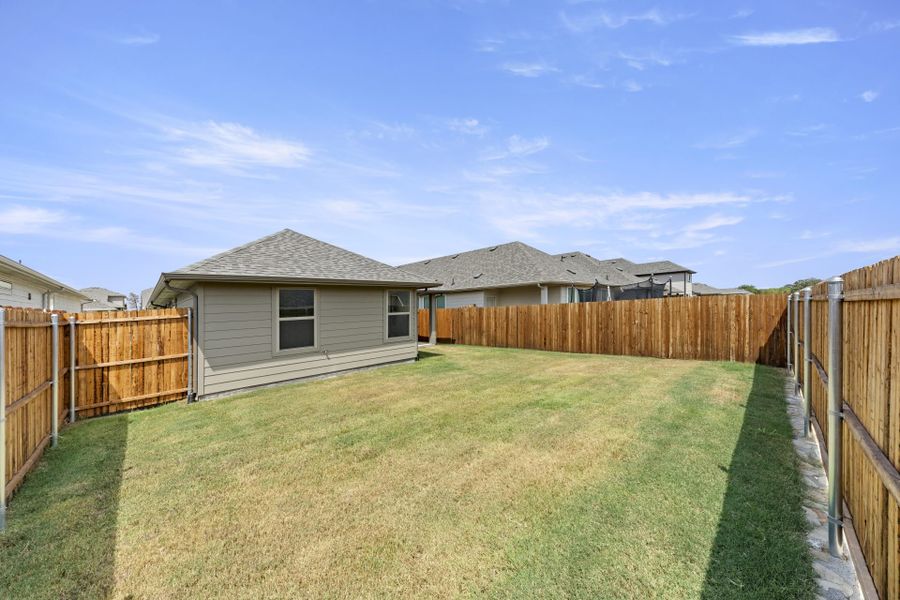 Exterior details and patio area of a home in Keeneland, Aubrey (Image 21).